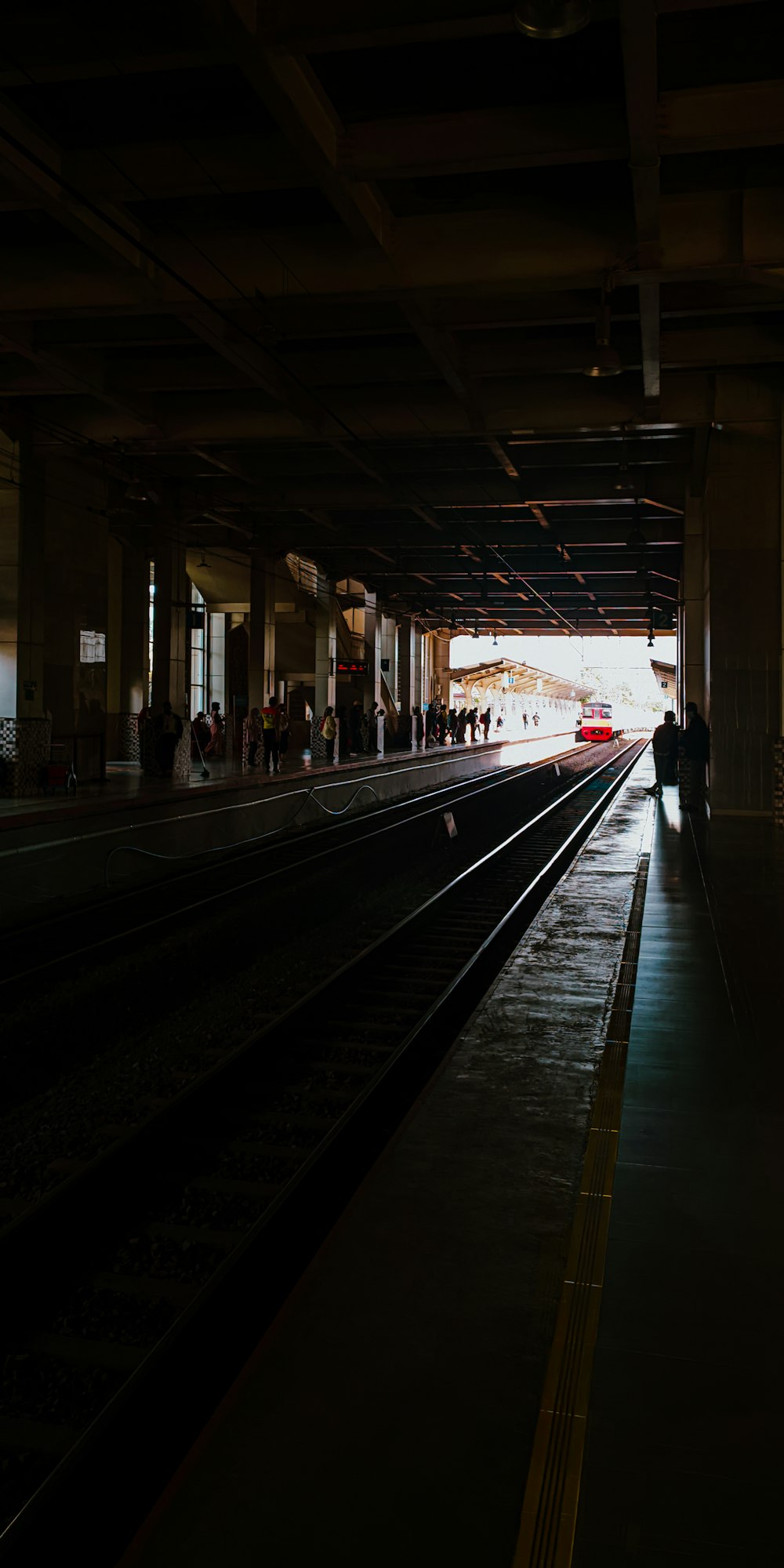 a train station with a train on the tracks