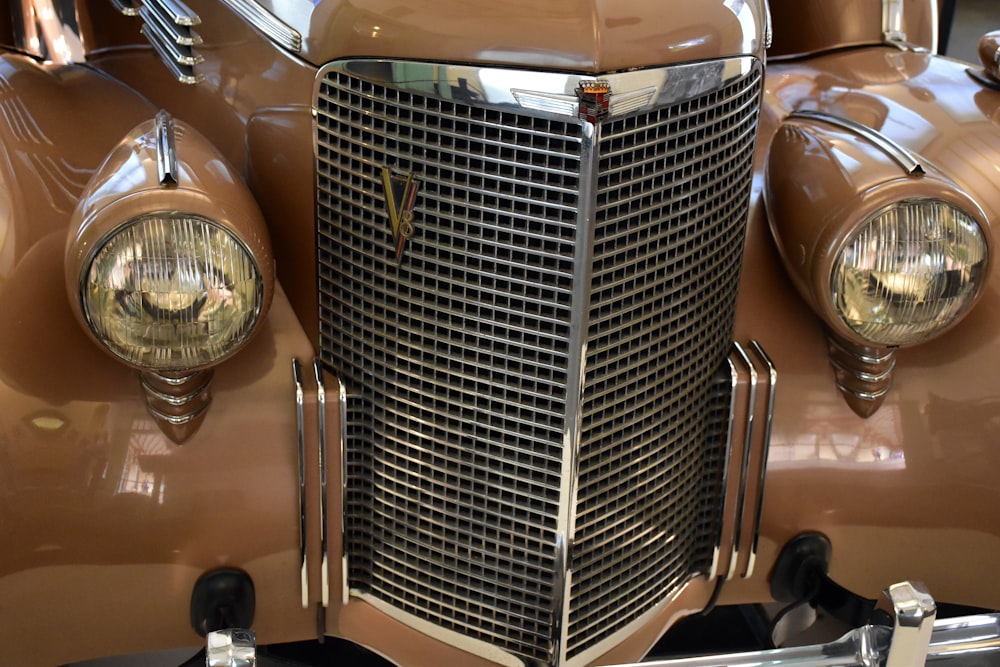 a close up of the front of a classic car