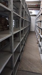 a long row of shelves filled with lots of boxes