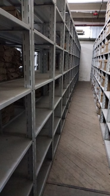 a long row of shelves filled with lots of boxes