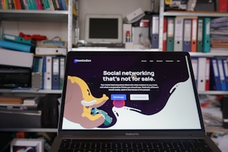 a laptop computer sitting on top of a desk