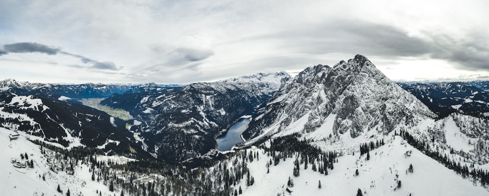 a view of a mountain range with snow on it