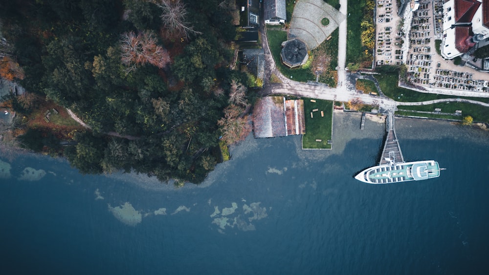 an aerial view of a boat in a body of water