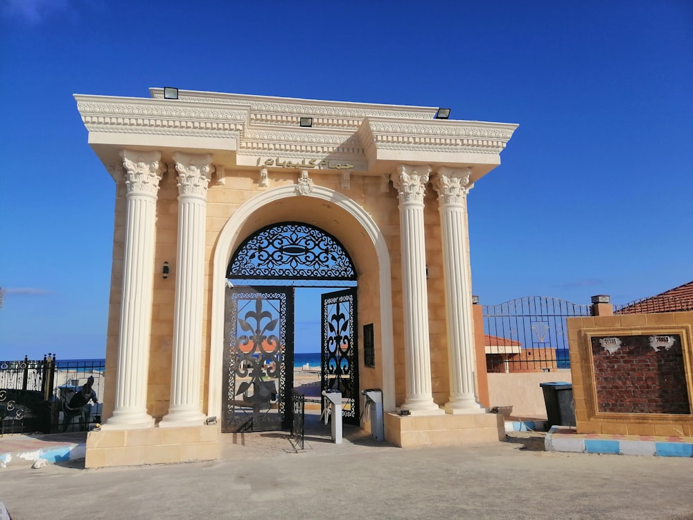 a large building with an ornate entrance and a blue sky