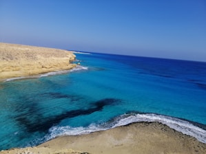 Pristine turquoise waters and sandy beaches along Antalya’s coastline under a clear sky.