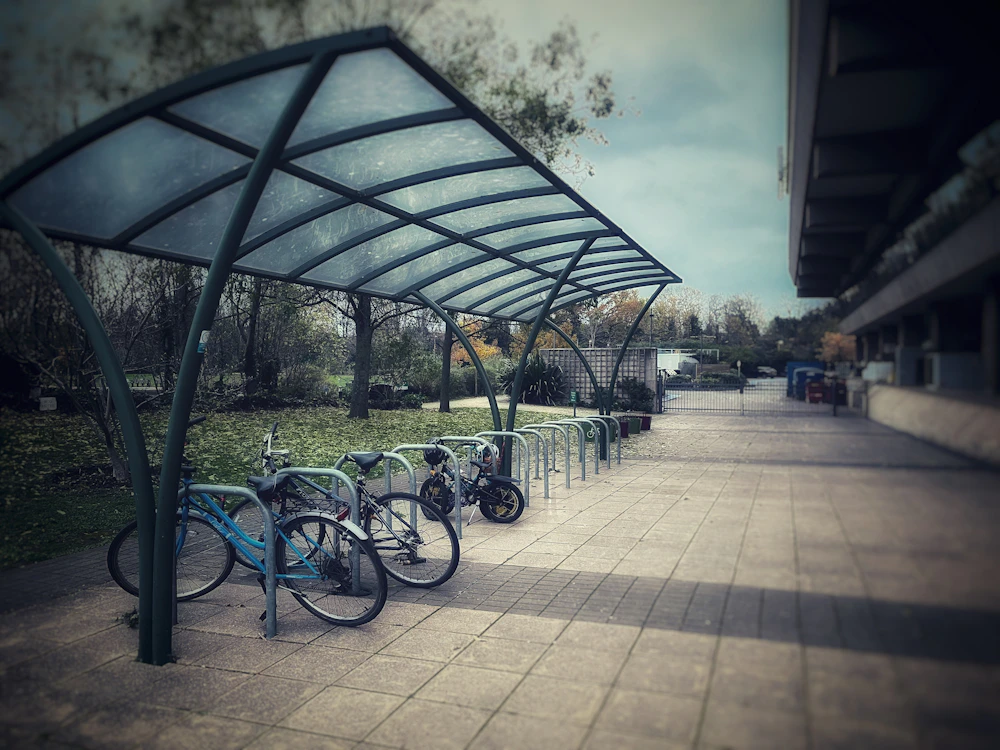 Bicycles parked in a row on a bike rack