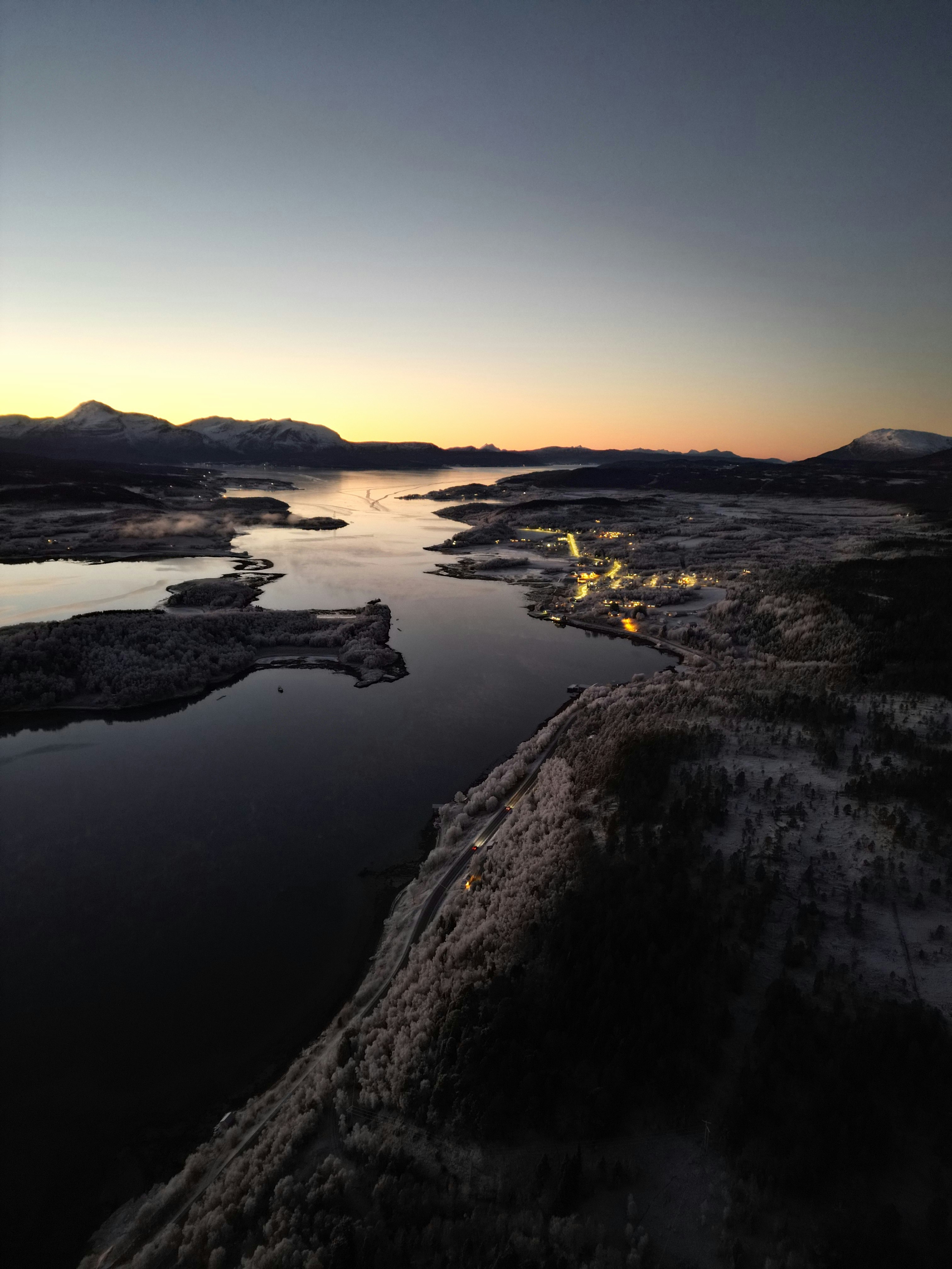 the sun is setting over a body of water