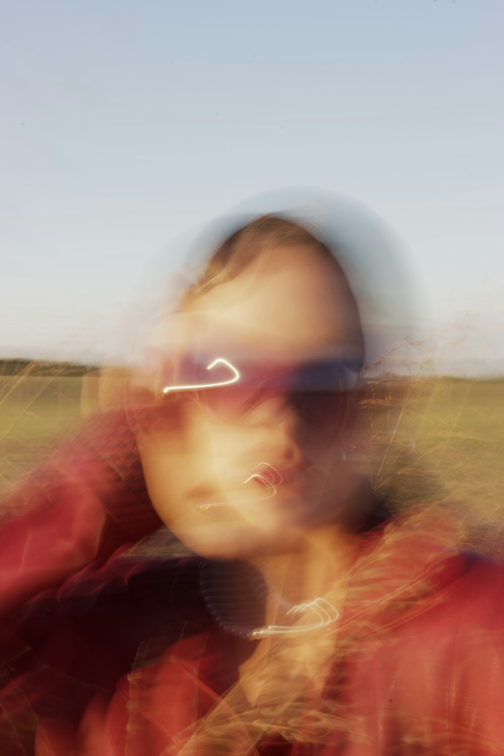 a blurry photo of a man in a red jacket