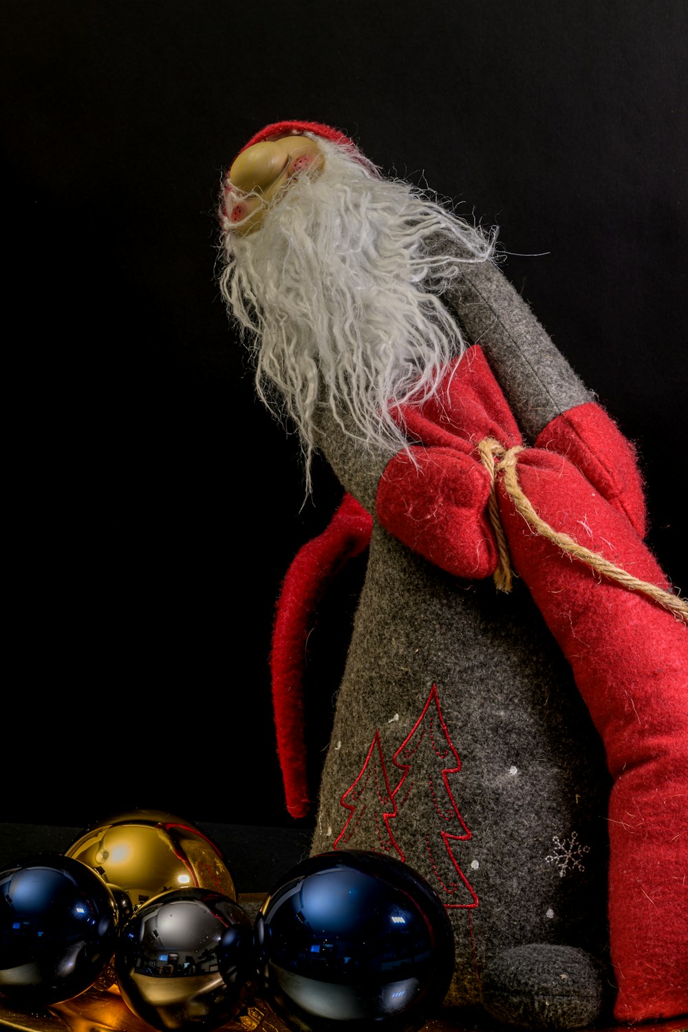 a santa clause doll sitting on top of a table