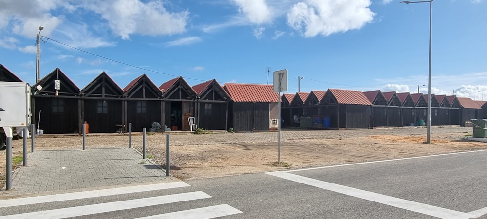 a row of houses sitting on the side of a road