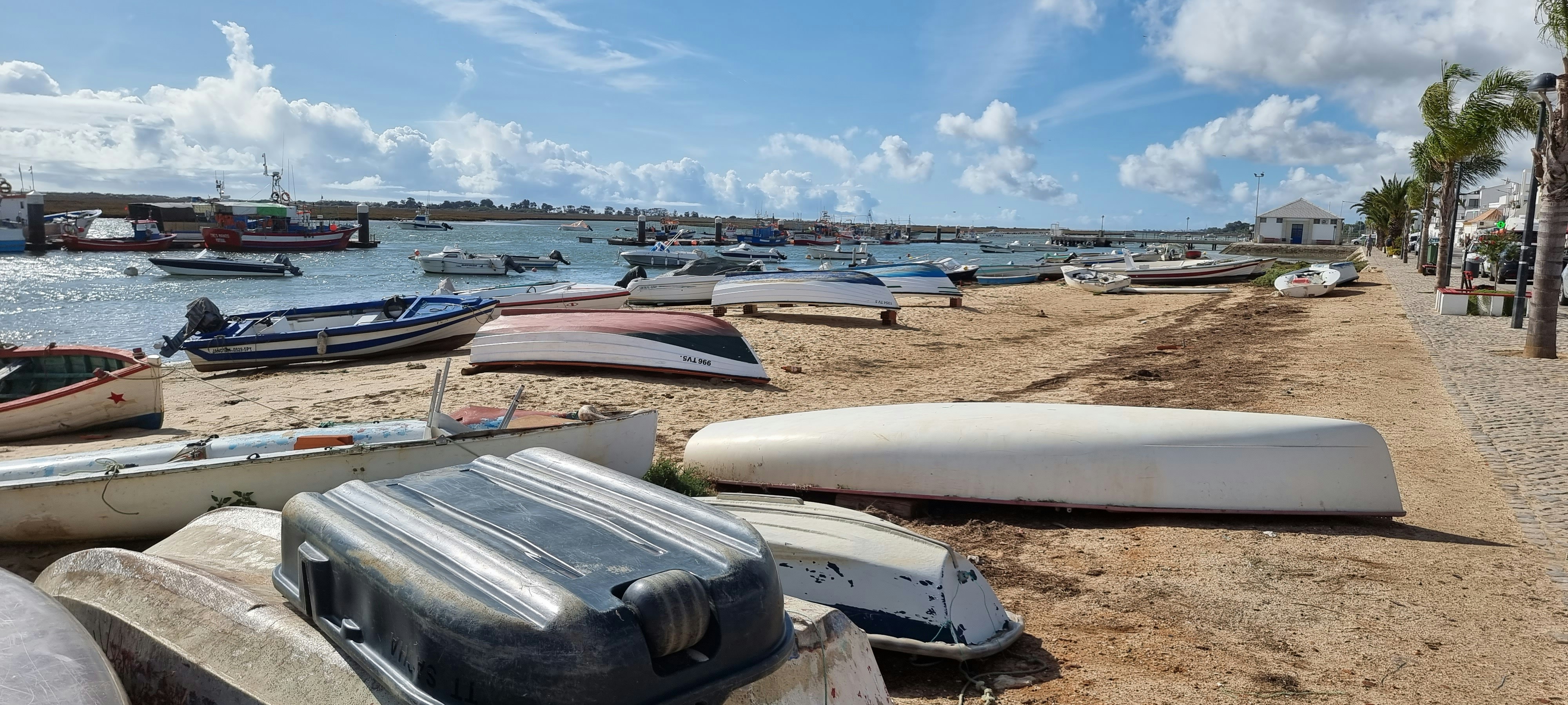 a bunch of boats that are sitting in the sand