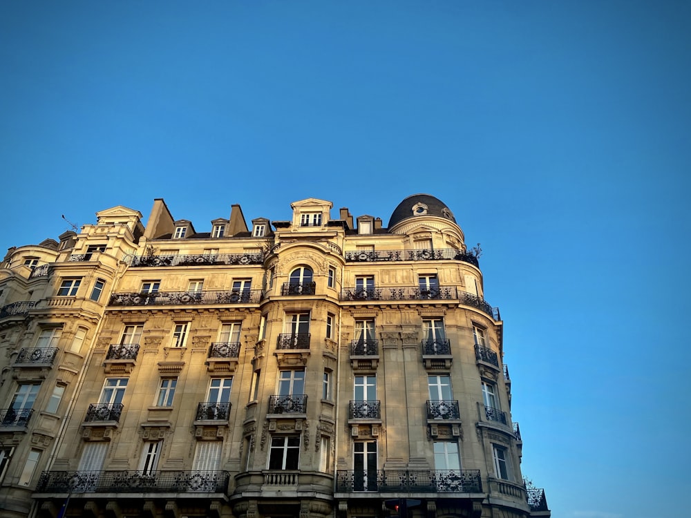 a tall building with balconies and balconies on the top of it