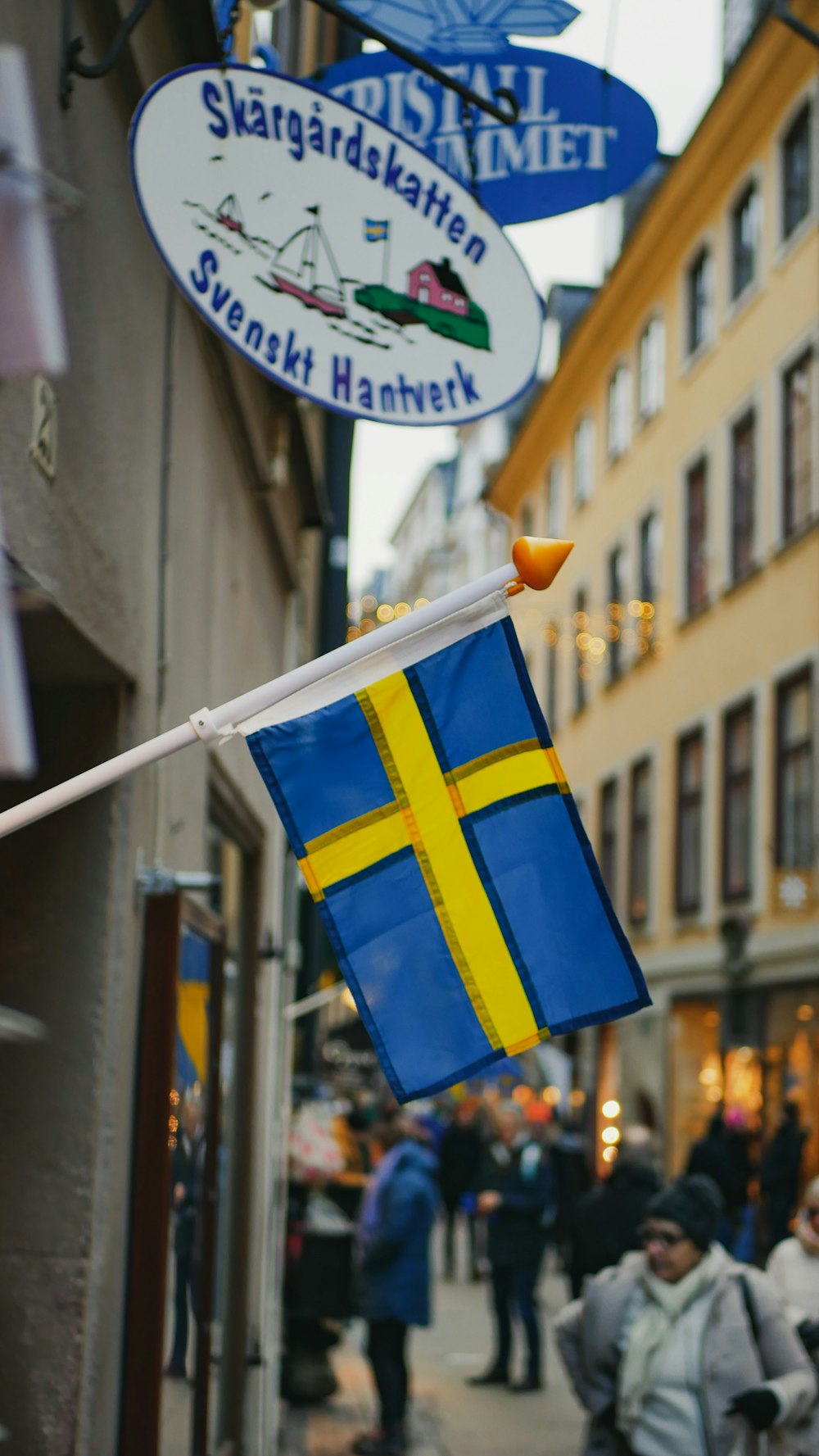 a flag hanging from the side of a building