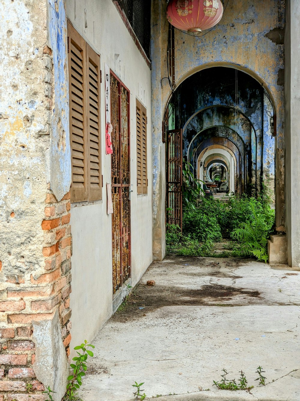 an old building with a bunch of windows and shutters