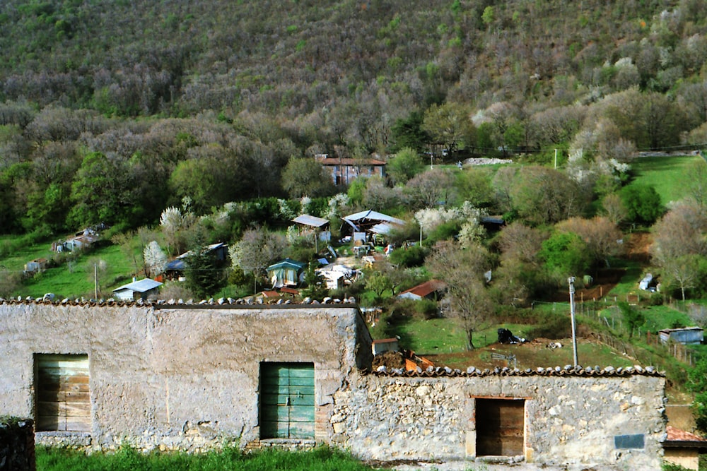 an old stone building with a green roof