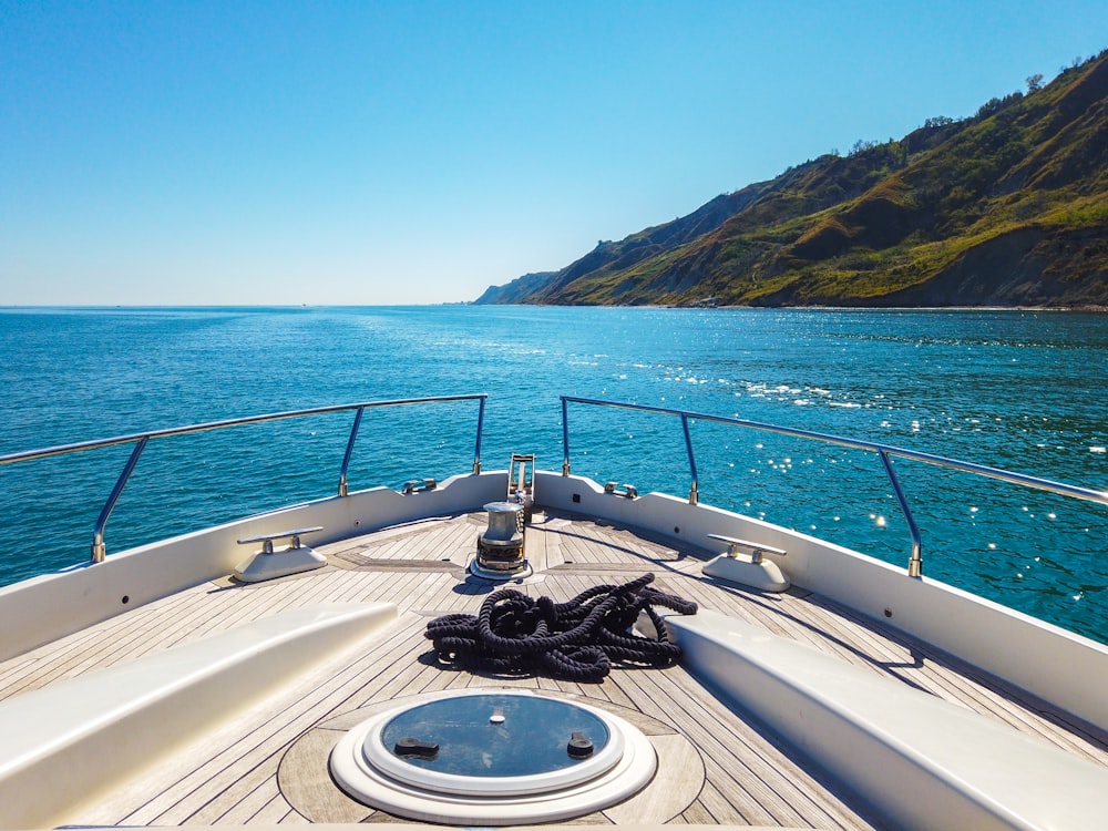 a view of the back of a boat on the water