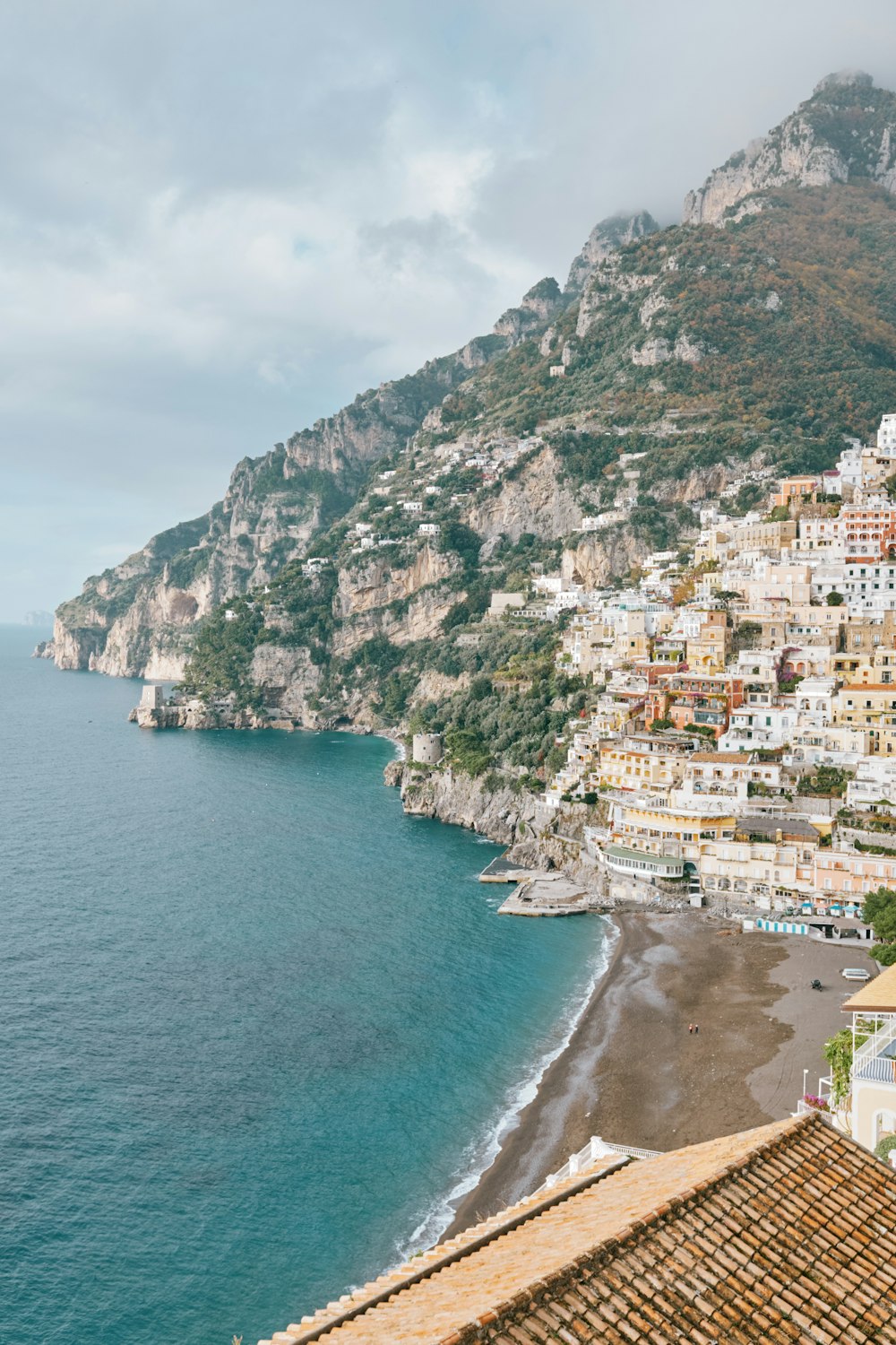 a view of a beach and a city from a hill