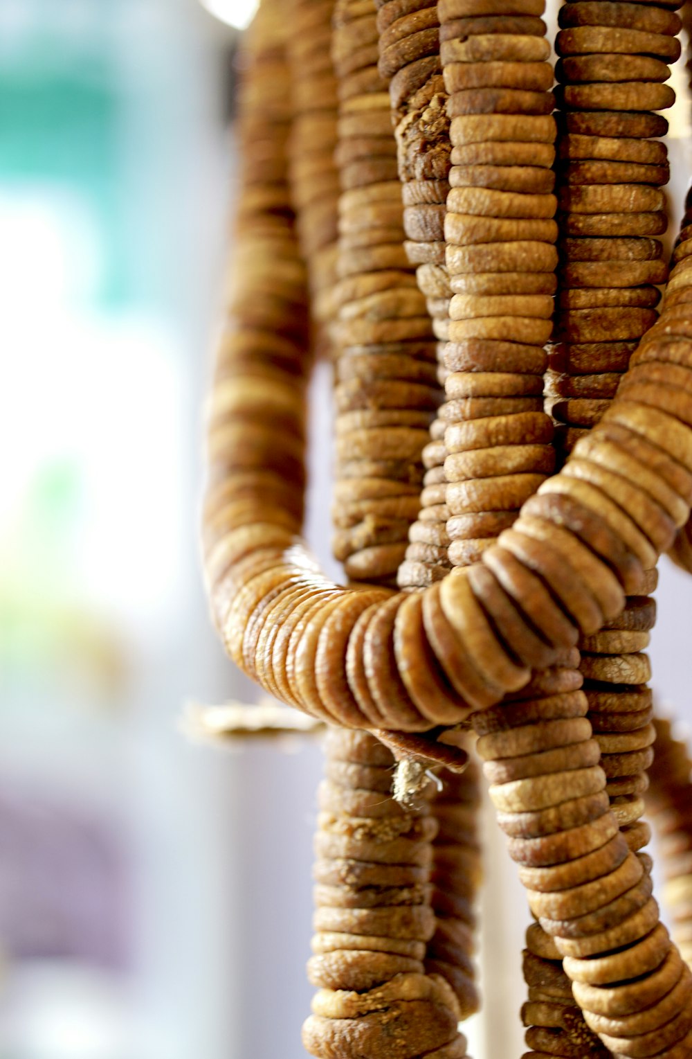 a close up of a bunch of crackers hanging from a hook