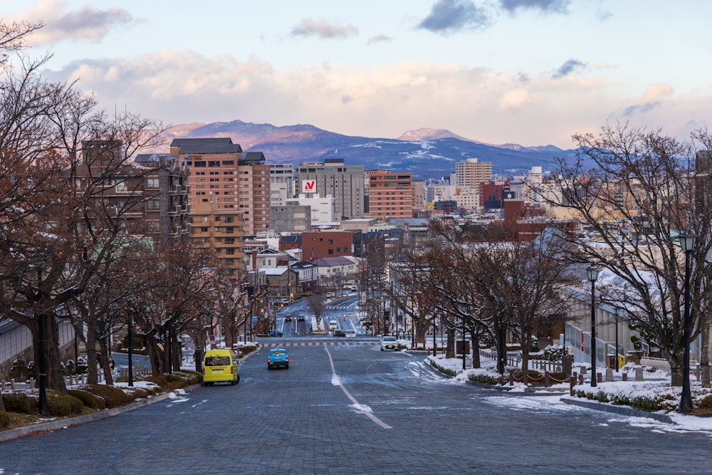 a view of a city street with snow on the ground