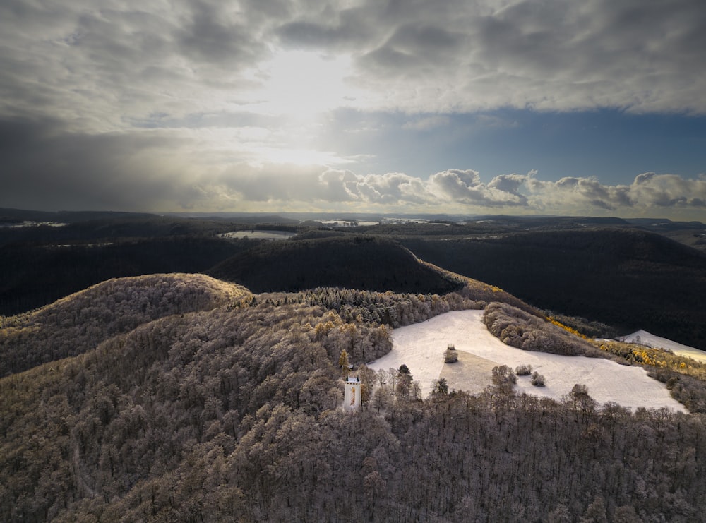 an aerial view of a snow covered mountain