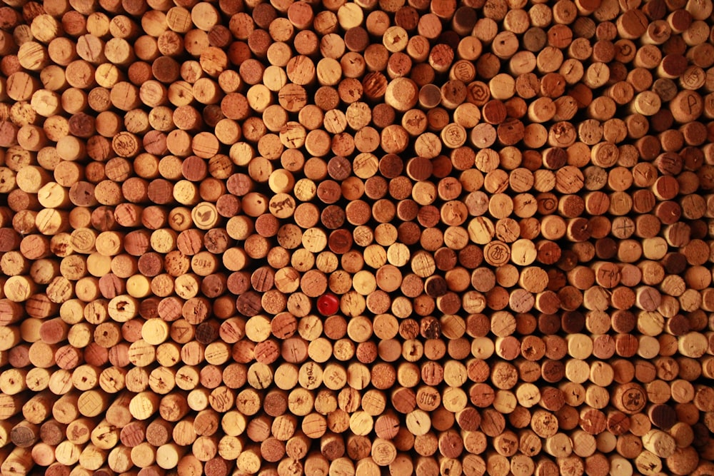 a large amount of wine corks are stacked on top of each other