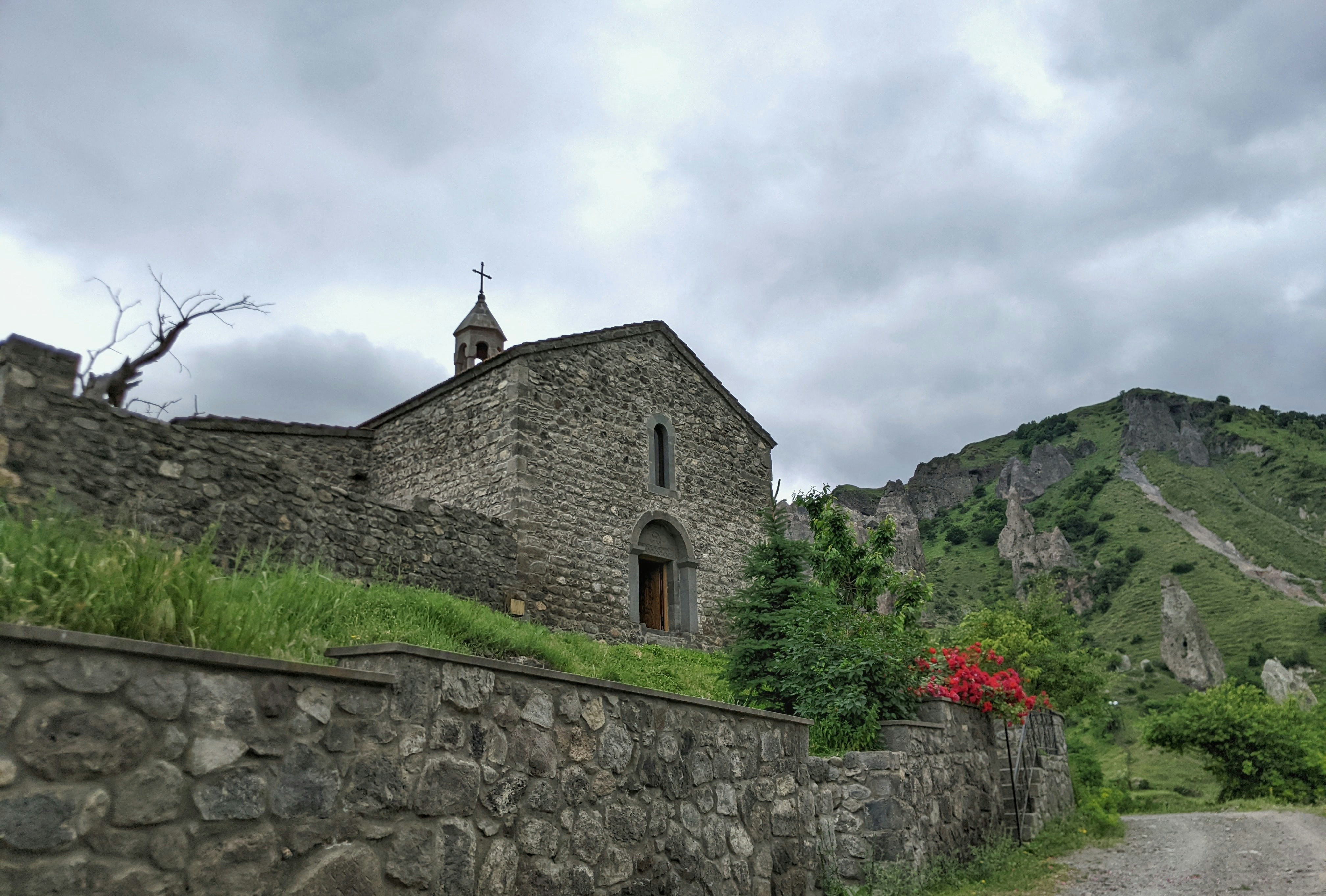 a stone building with a steeple on top of it