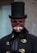 a man in a top hat with a skull on his face