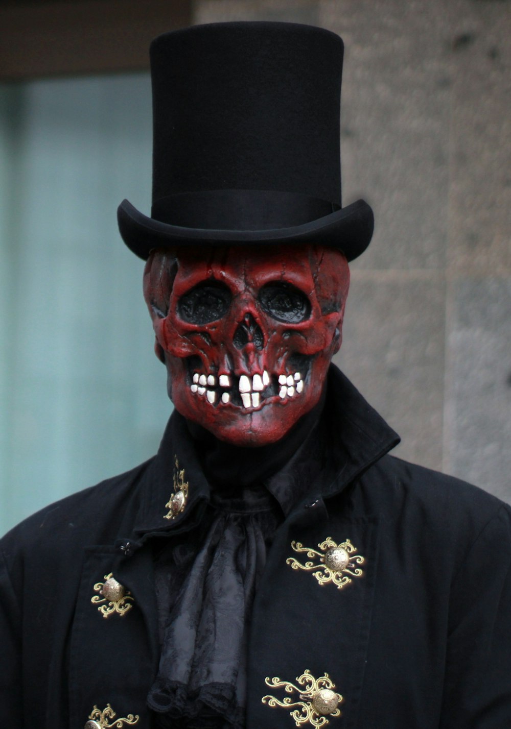 a man in a top hat with a skull on his face