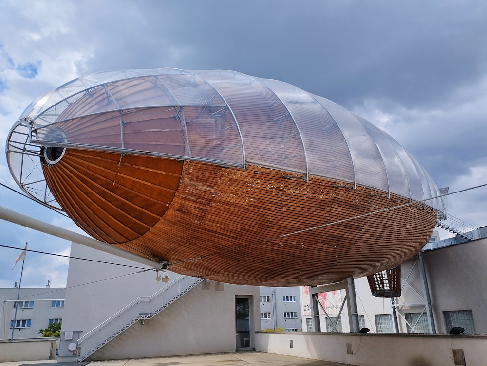 a large wooden boat sitting on top of a building