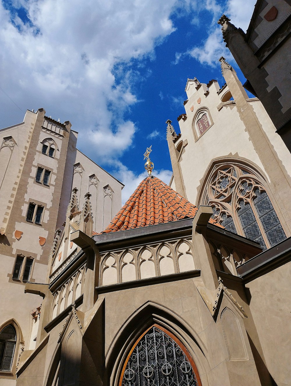 a church with a red roof and a tall tower