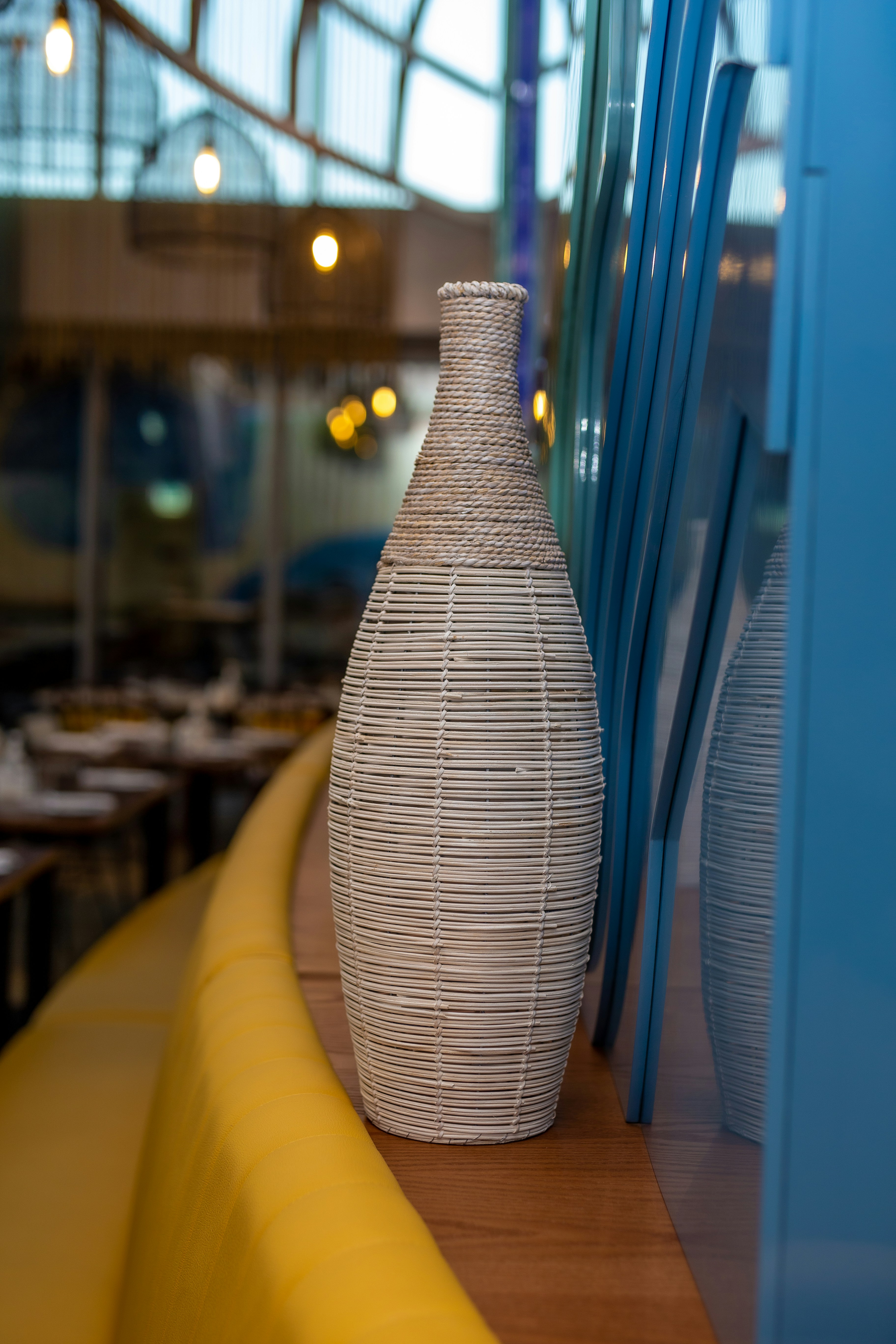 A white vase sitting on top of a wooden table photo – Free Art Image on ...