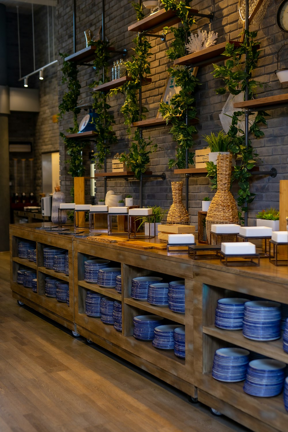 a large display of blue plates and vases