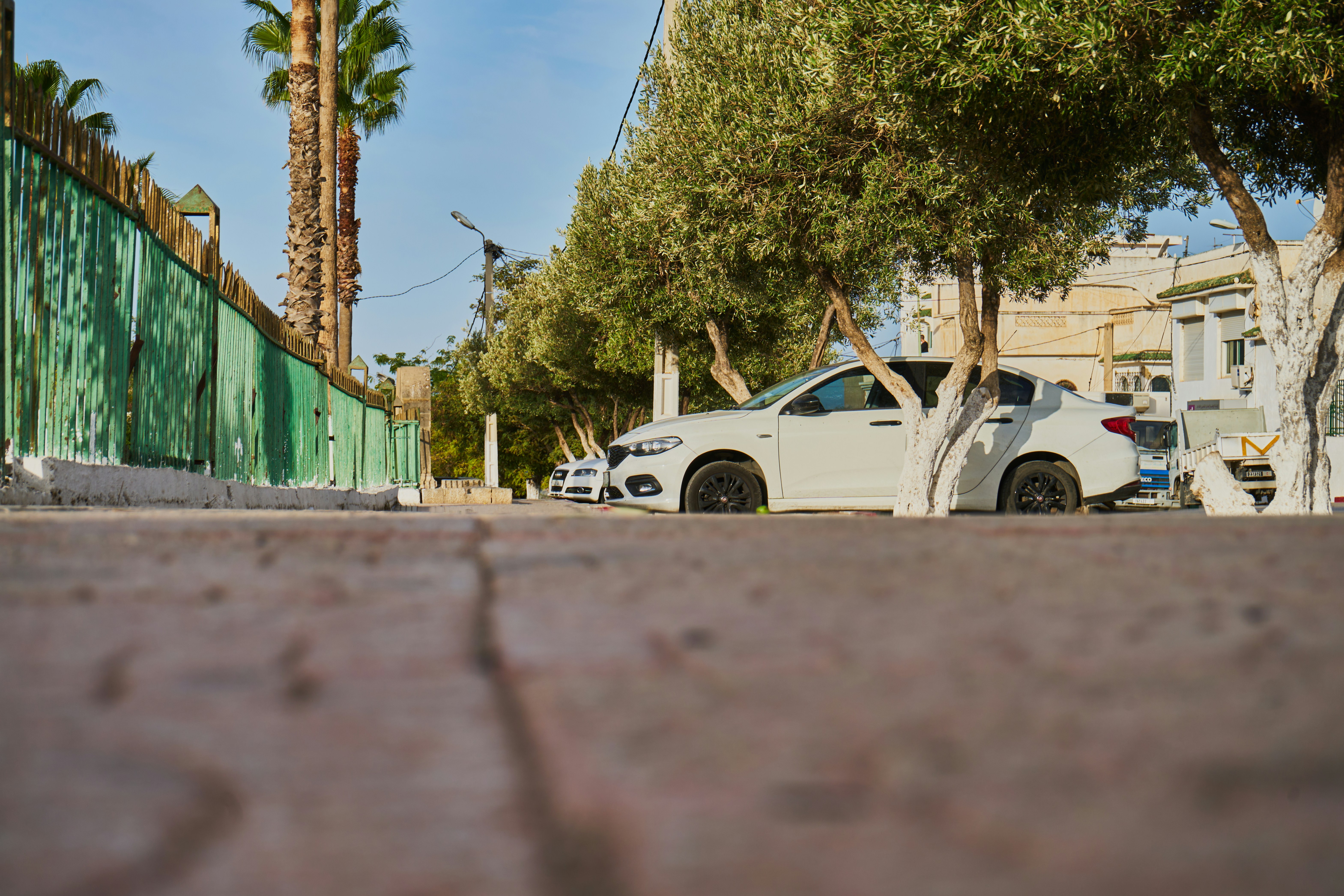 a white car parked on the side of the road