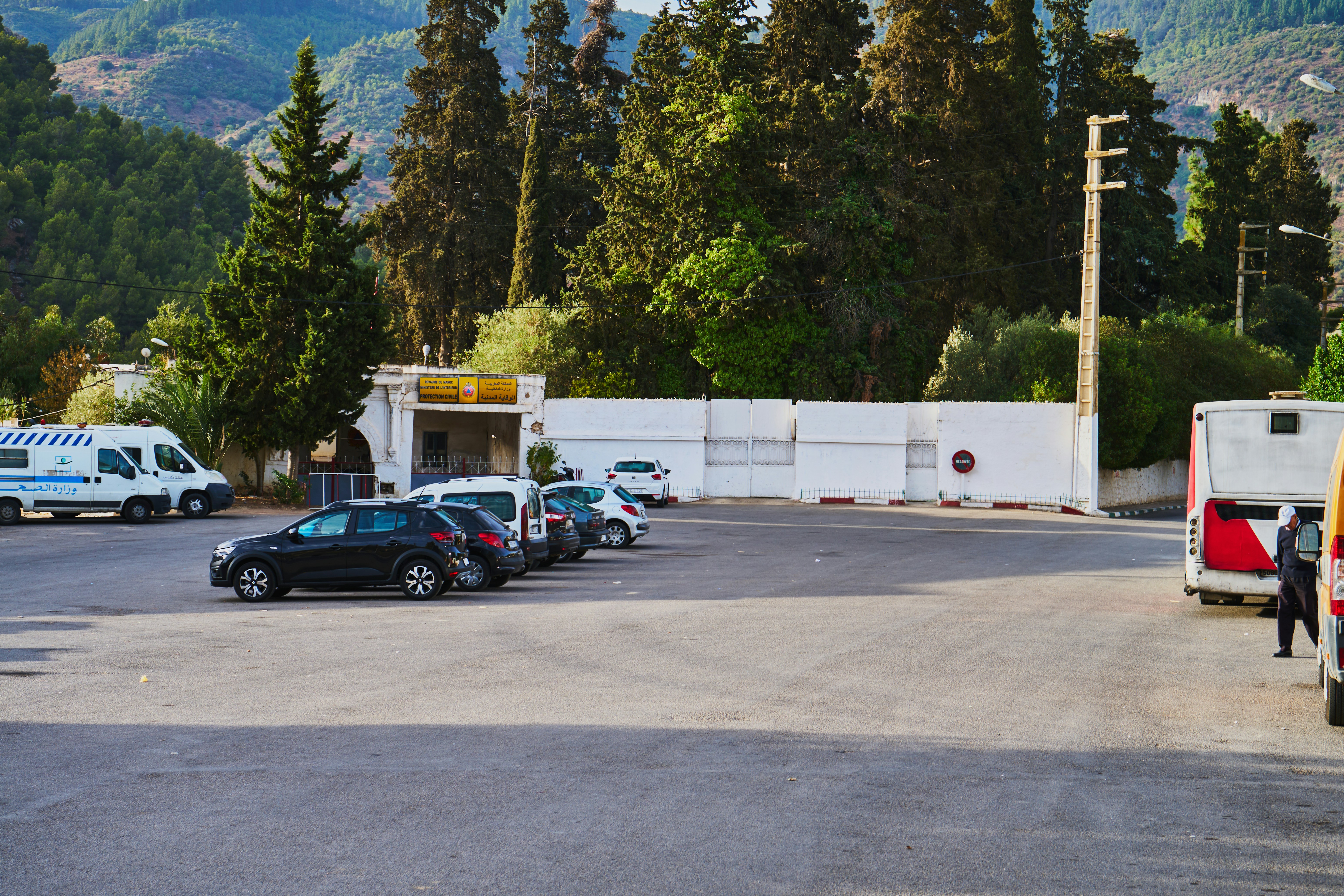 a parking lot filled with lots of parked cars