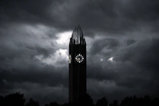 An ultra-realistic image of an ancient clock surrounded by dark clouds and faint golden light piercing through.