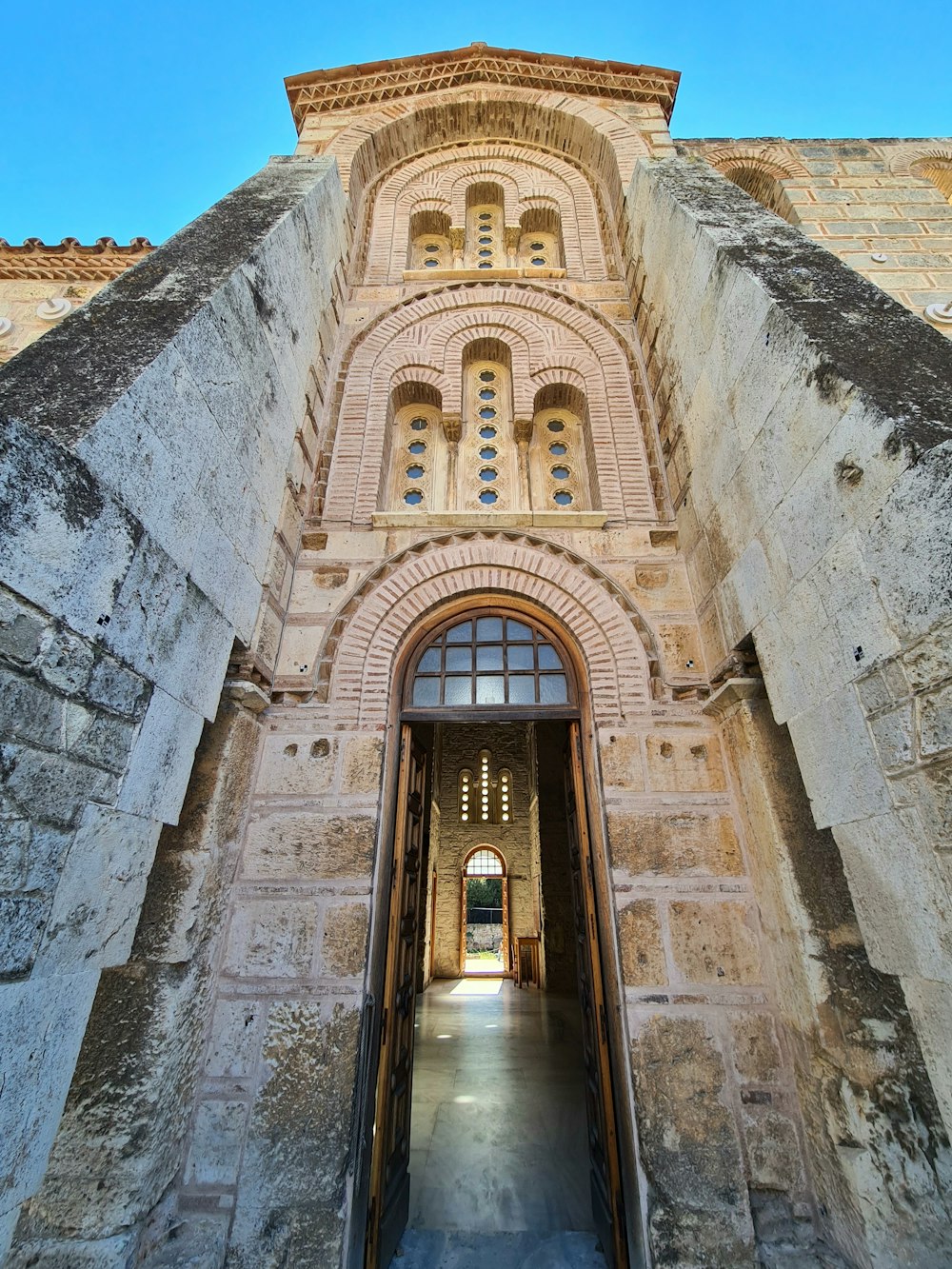 a very tall building with a very big door