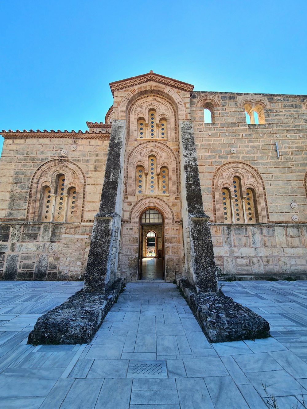 a large stone building with a very tall entrance