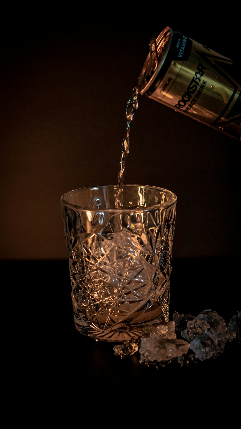 a bottle of alcohol being poured into a glass