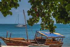 a couple of boats sitting on top of a beach