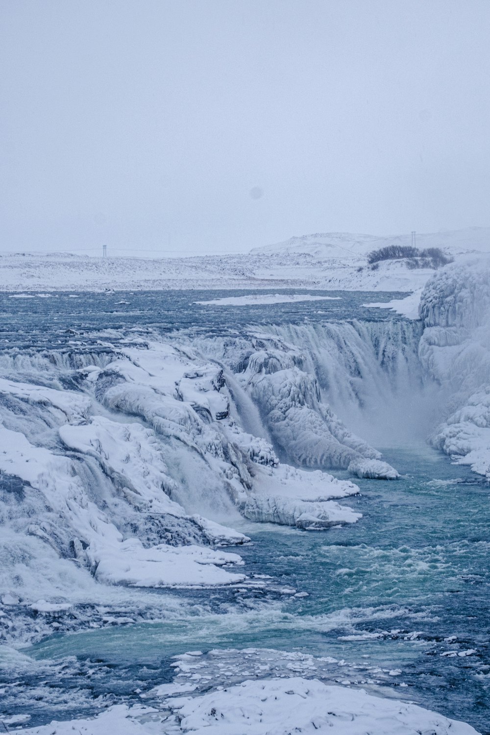 a river running through a snow covered landscape