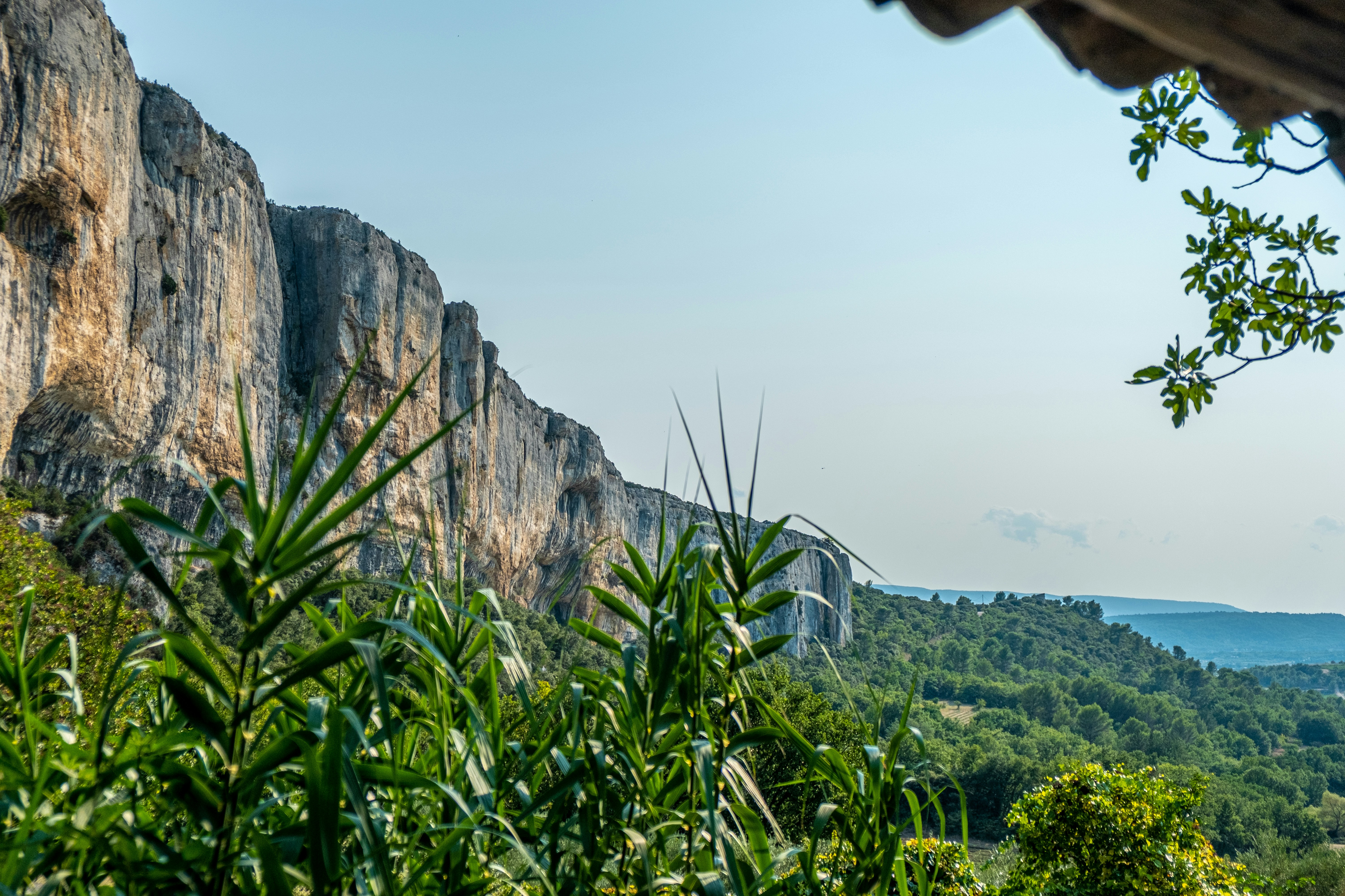 a view of a mountain with a bridge in the distance