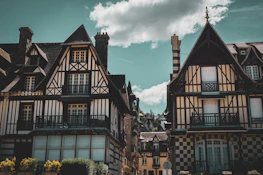 a group of buildings with a sky background