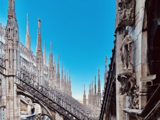 a view of a very tall building with many spires