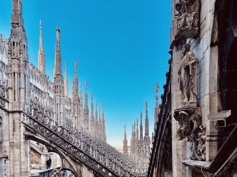 a view of a very tall building with many spires