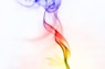 a red, yellow and blue smoke is in the air