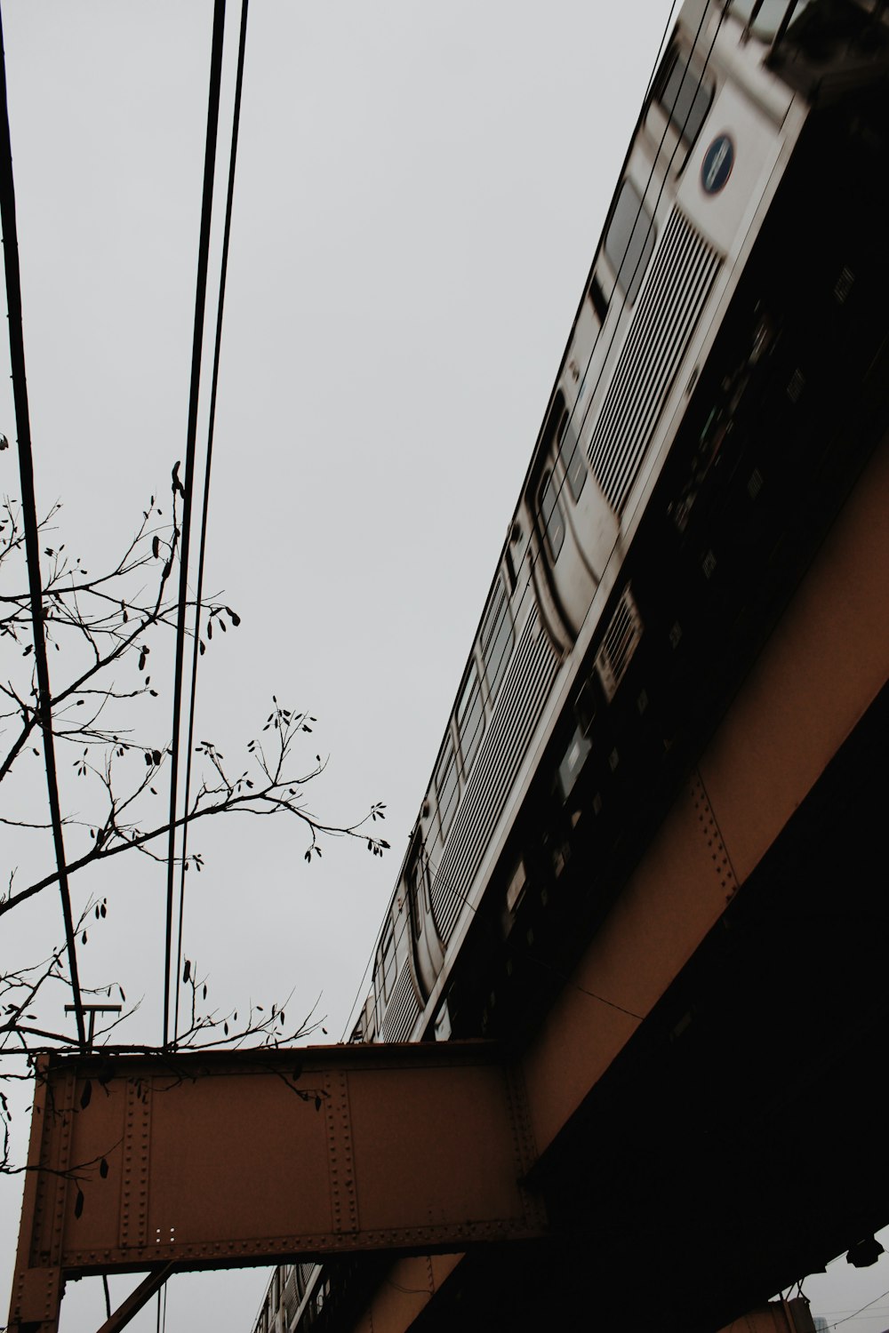 a train going over a bridge on a cloudy day