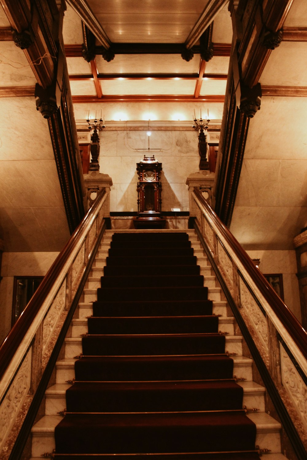 a set of stairs leading up to a clock