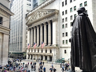 a statue of a man in front of a building