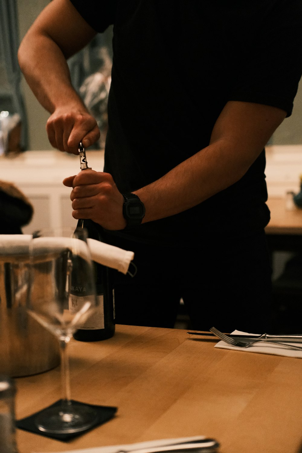 a man is holding a wine bottle in his hand