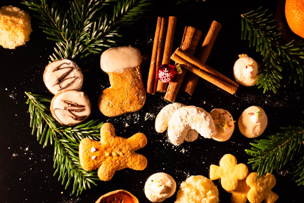 a black table topped with cookies and oranges